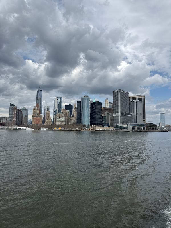 NYC skyline photographed from waterfront showing One World Trade Center