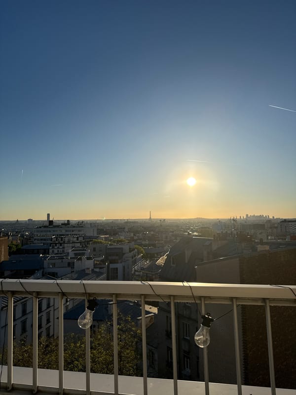 Sunrise view captures Eiffel Tower from Paris balcony