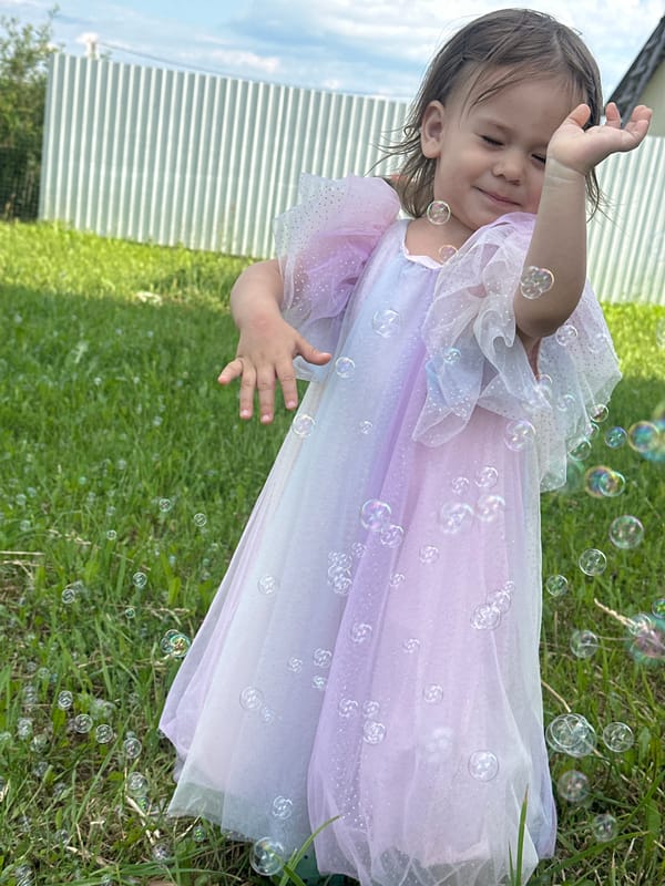 Mother and toddler enjoy bubble play in Kharnavy backyard