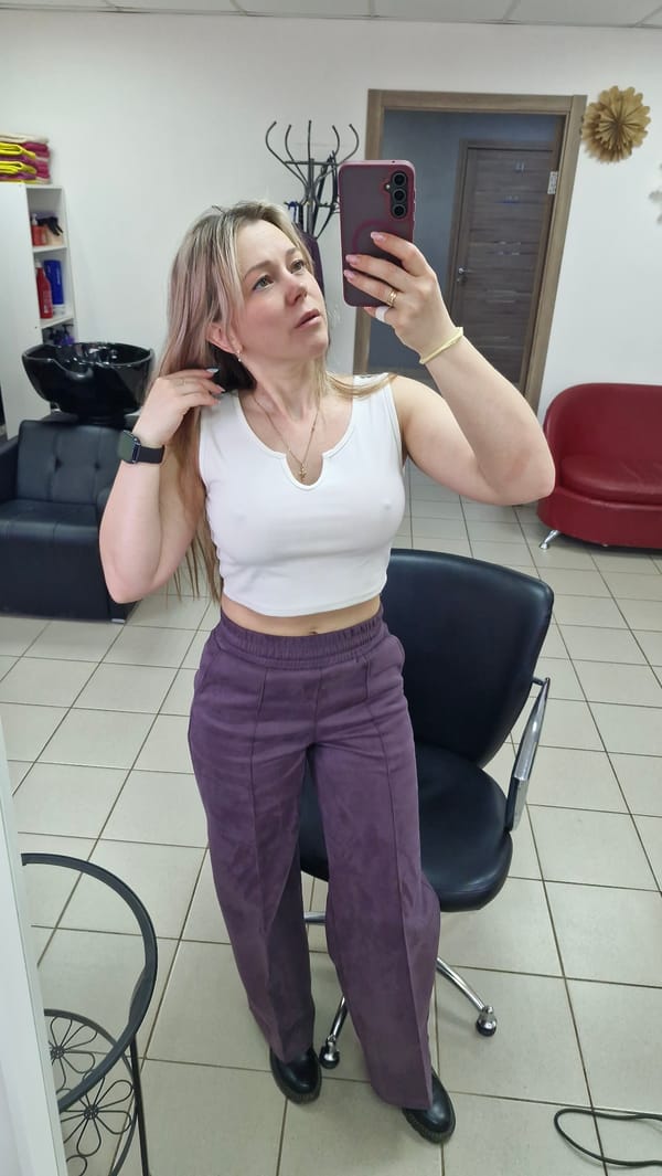 Woman takes selfies in Russian hair salon early morning