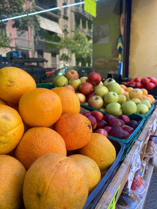 Street-level Barcelona: buildings, food, murals, and shuttered shops
