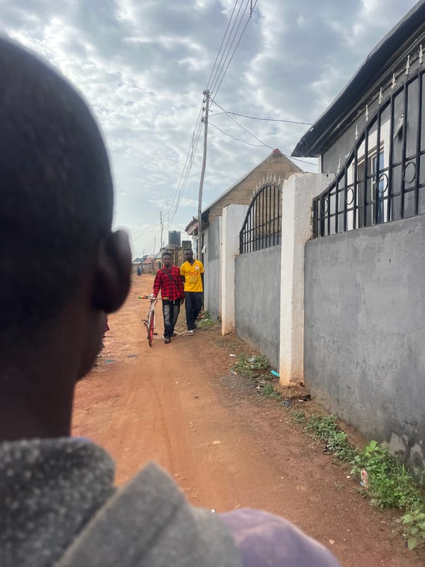 Morning street documentation captures Abuja residential scenes, waste areas