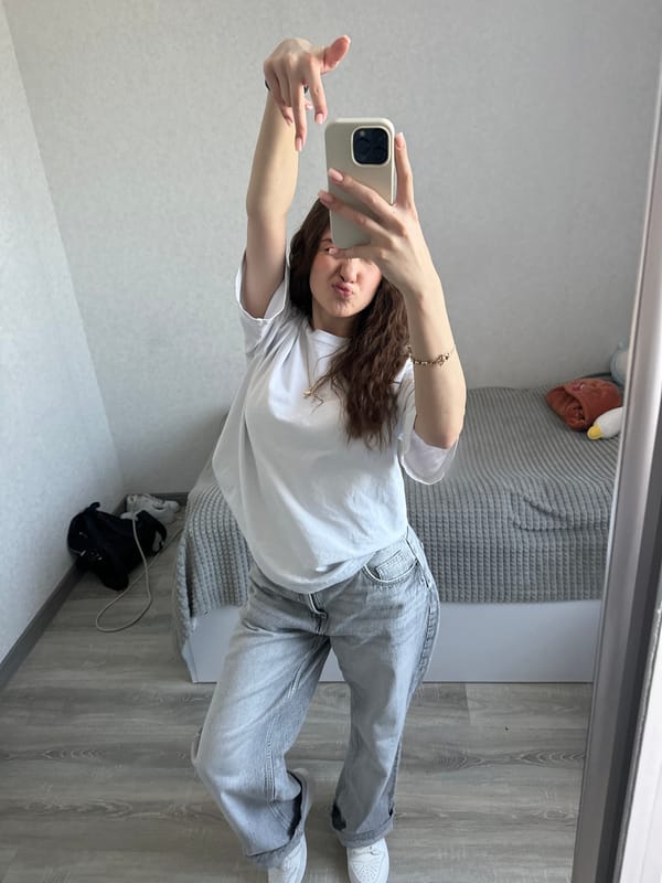Woman takes mirror selfie in early morning Yerevan