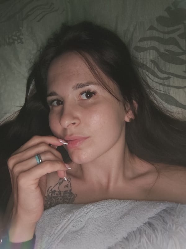 Woman photographed in bedroom setting in Фоки, Russia