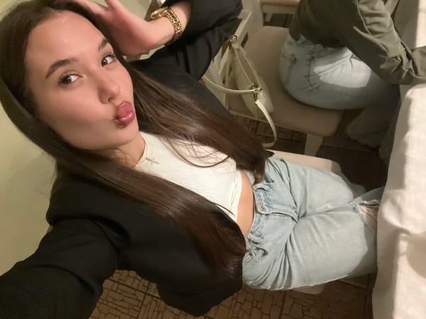 Women pose for selfies with drinks in Chaikovsky
