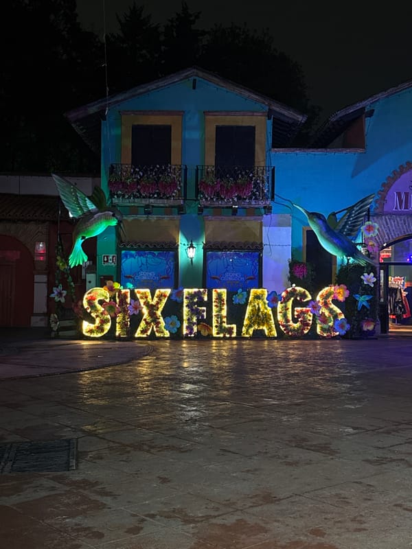 Neon Superman logo glows in Mexico City night