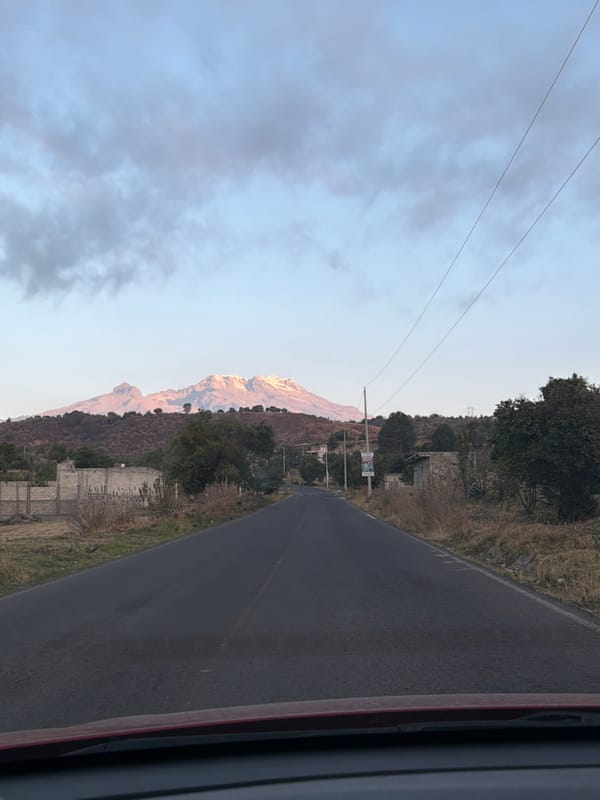 Mountain landscape captured from moving vehicle near Santiago Xalitzintla