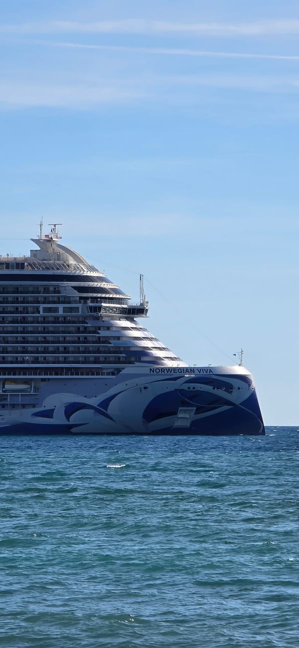 Cruise ship anchored off Bar Montenegro during busy afternoon