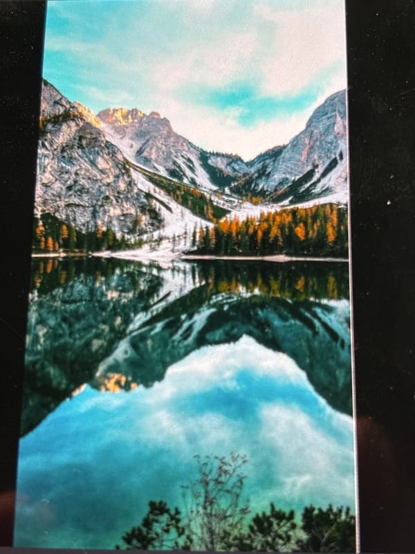 Witness captures symmetrical mountain landscape with rock formations