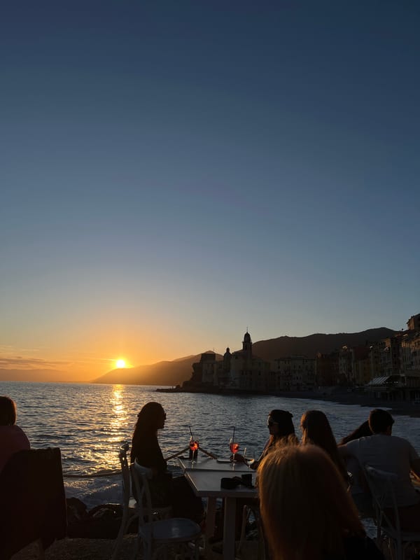 Sunset dining captured at Camogli waterfront, Italy