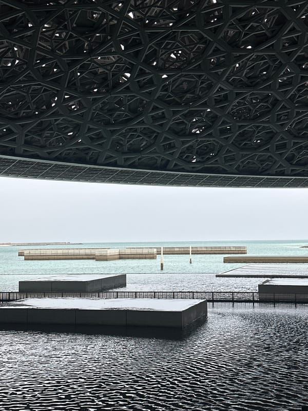 Visitor explores Louvre Abu Dhabi's architecture and art displays