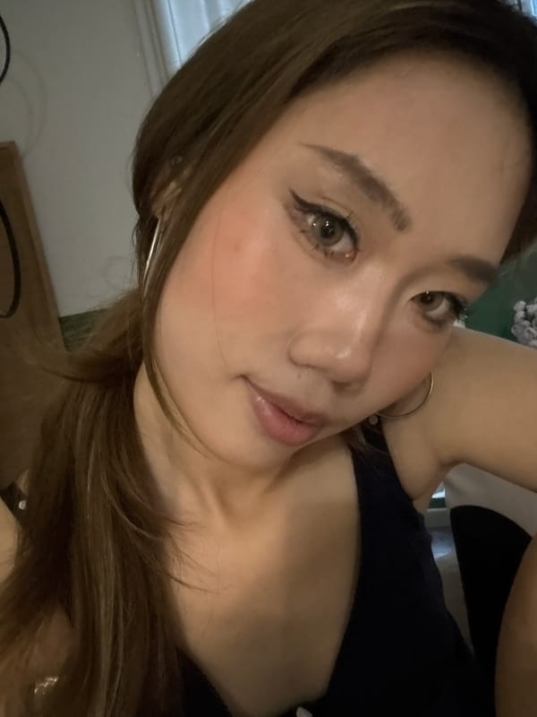 Woman takes selfies on bed in Liangjiang, China