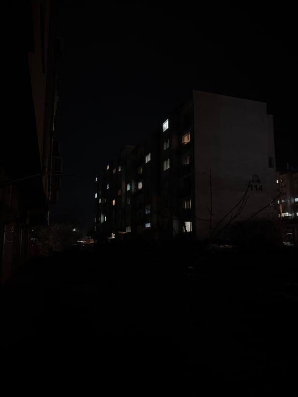 Evening streetlights illuminate occupied buildings in Burgas, Bulgaria
