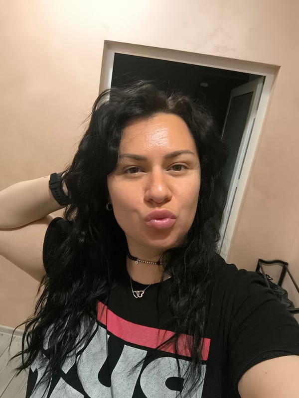 Woman takes selfie indoors in Pleven, Bulgaria
