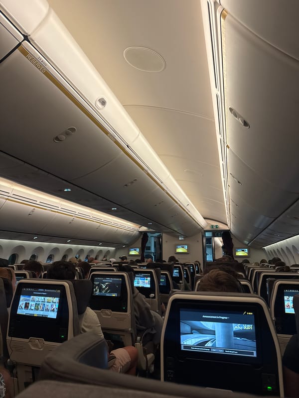 Aircraft cabin interior observed with active entertainment systems, Mai Khao