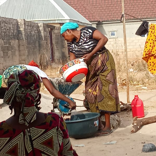 Women gather for food processing activities in Doma, Nigeria