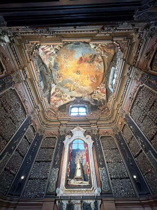 Tourist documents Milan's historic bone church and cathedral views