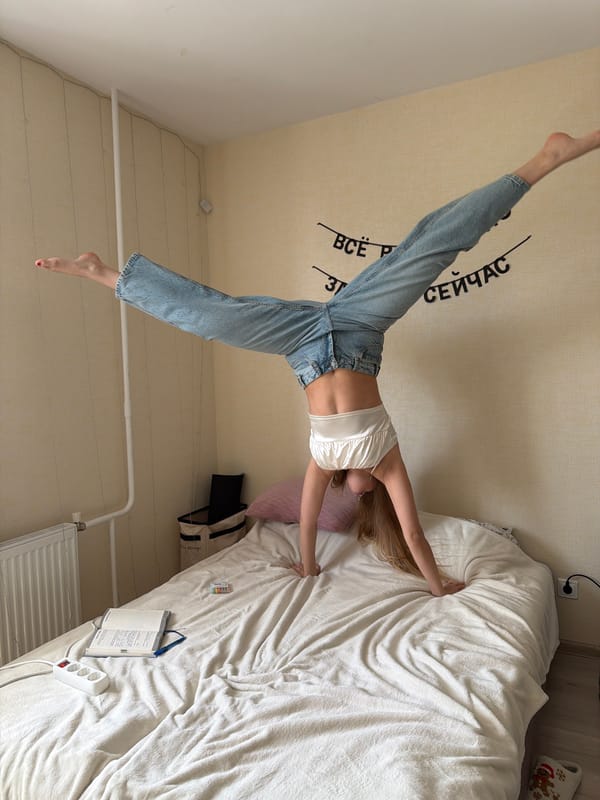 Woman poses with flower bouquet in Izhevsk apartment