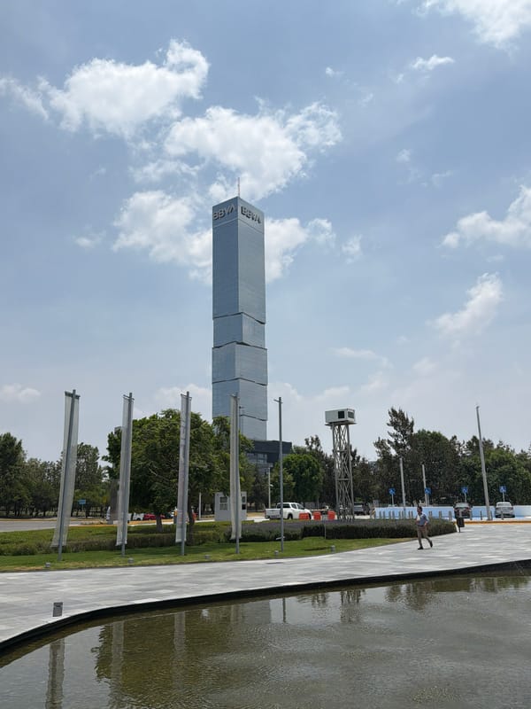BBVA Tower and public sculpture observed in Tlaxcalancingo