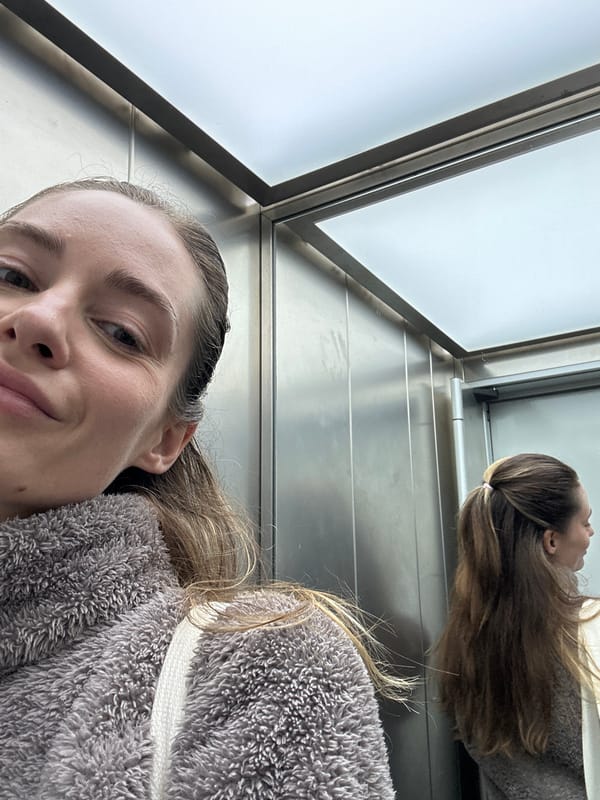 Woman documents morning coffee routine in Kiel elevator selfies