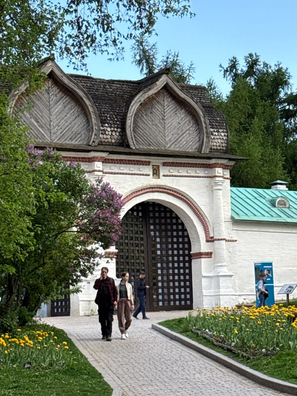 Visitor documents historic Kolomenskoye Estate architecture in Moscow