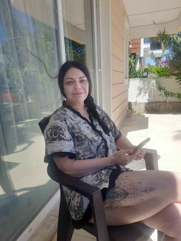 Woman photographed on sunny patio in Kemer, Turkey