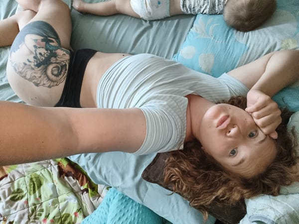 Quiet moment in bed with two babies close by