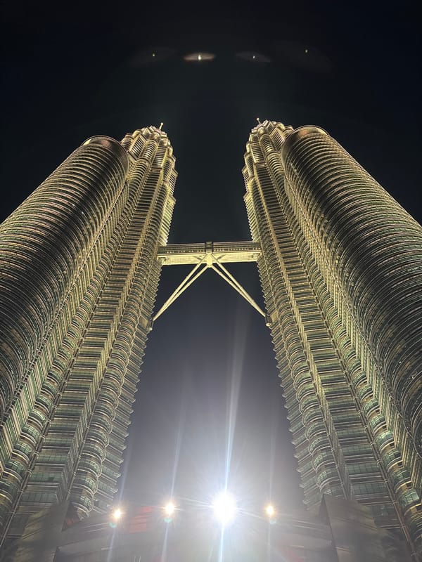 Evening documentation of Petronas Towers and KLCC area