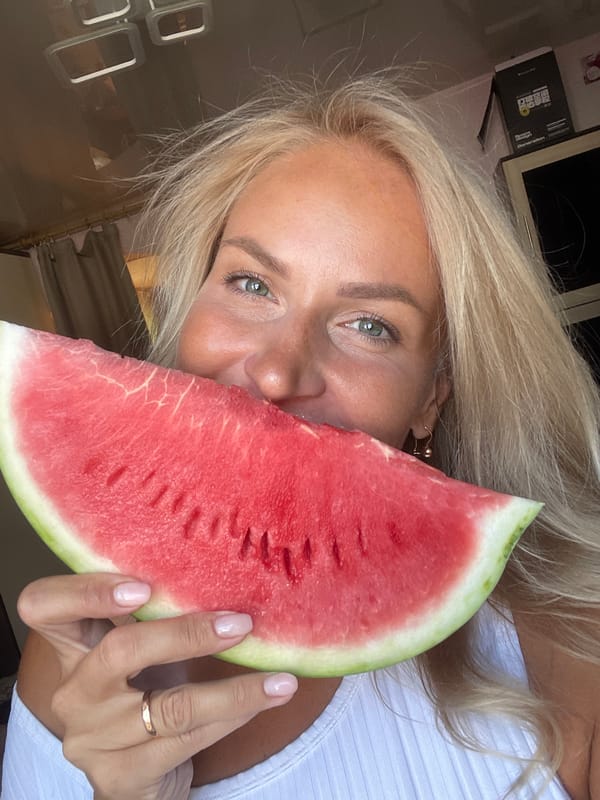 Watermelon held up to the face, summer vibes in Russia
