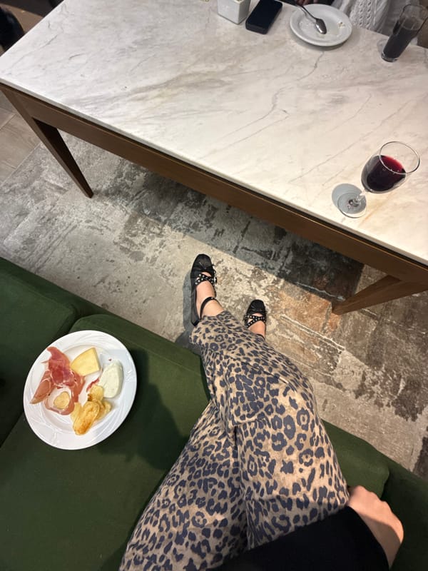 Woman enjoys wine and charcuterie evening at home in Mexico City