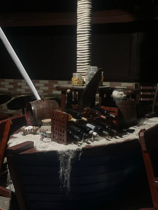 Nautical-themed store displays cannabis beverages, maritime decor observed