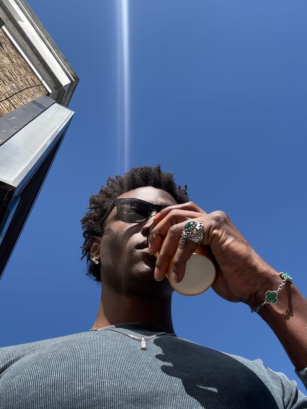 Man with yellow cup spotted outdoors in London