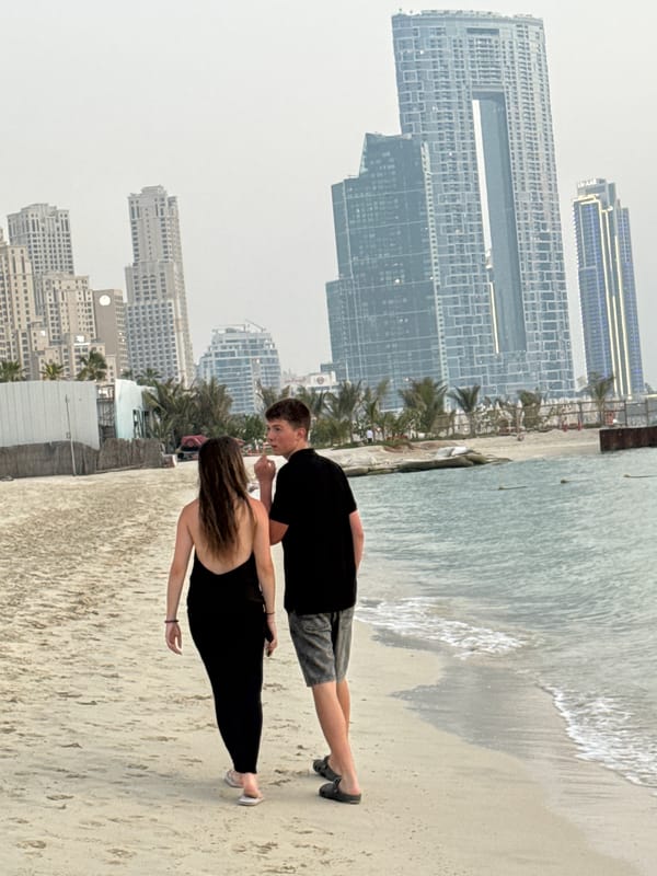 Dubai Marina beachfront: sand, camels, and skyline in one frame