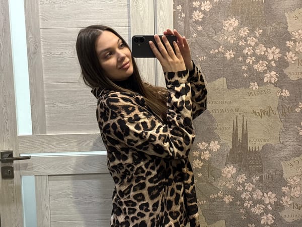 Woman takes selfies with Yekaterinburg city lights backdrop