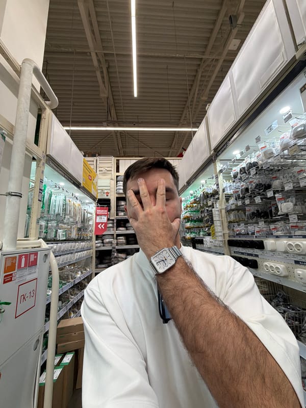Man covers face in Krasnoyarsk electronics store