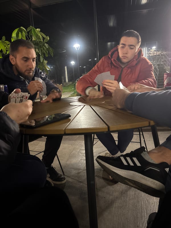 Evening card game among four people in Zlatitsa, Bulgaria