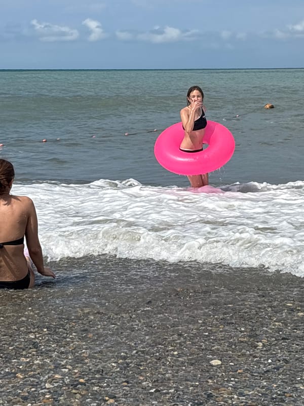 Cloudy day in the waves at a Sochi Black Sea beach