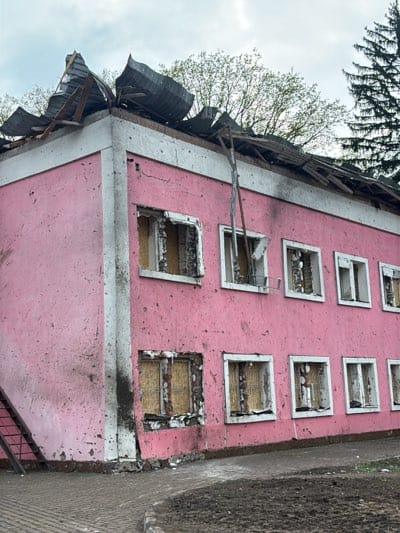 Damaged pink building complex documented in Kharkiv, Ukraine