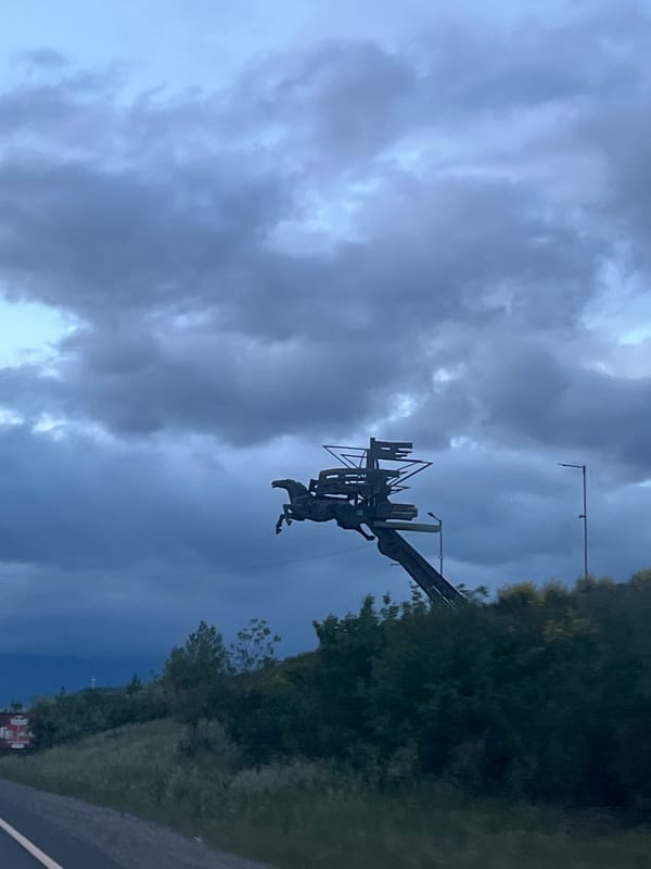 Metal horse-carriage statue observed on hill in Blagoevgrad, Bulgaria
