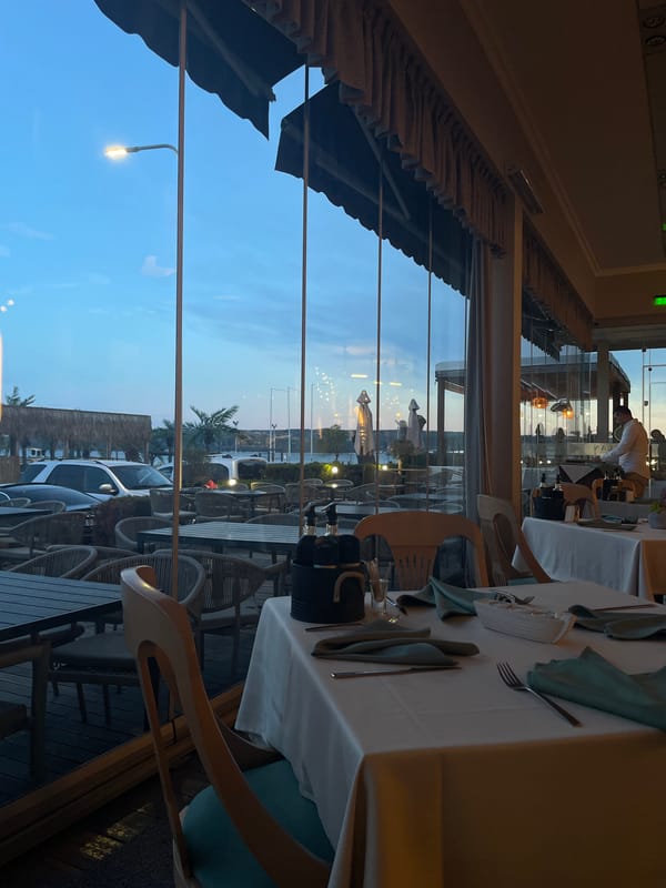 Restaurant dining room observed at dusk in Varna