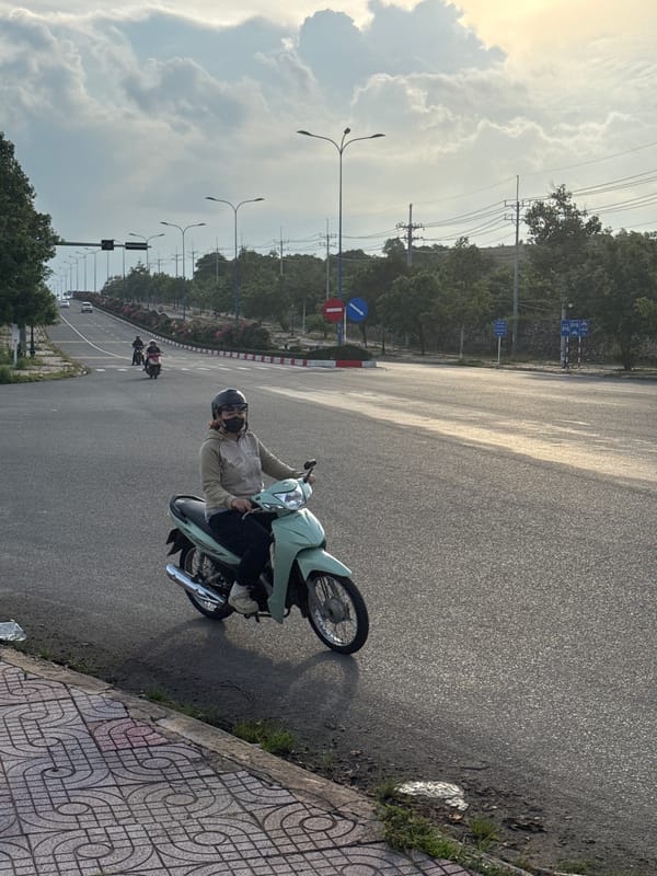 Morning scooter traffic flows through Mũi Né streets