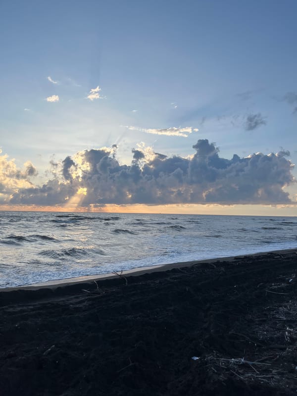 Sunset scenes along Ureki's black sand beach in Georgia