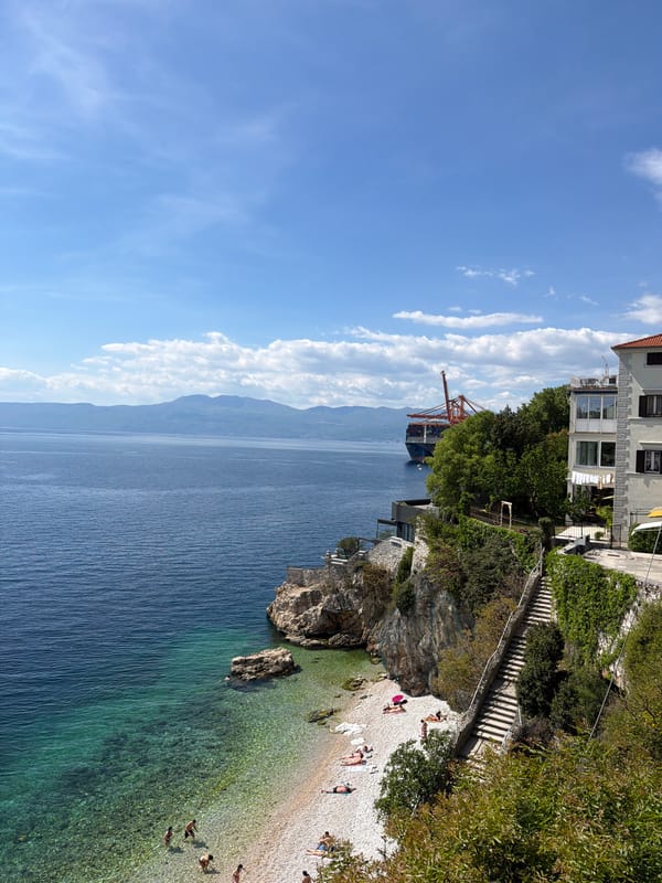 Spring beach activity and port operations in Rijeka, Croatia