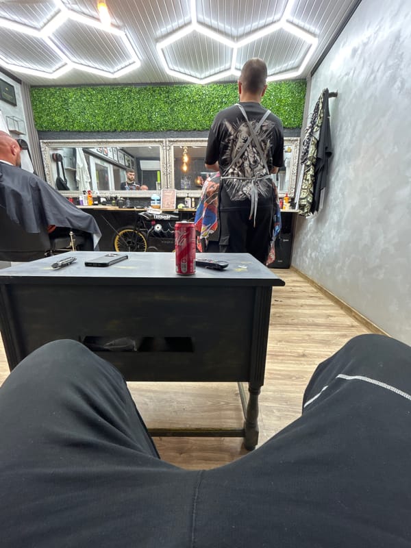 Customer gets haircut at barber shop in Byala Slatina