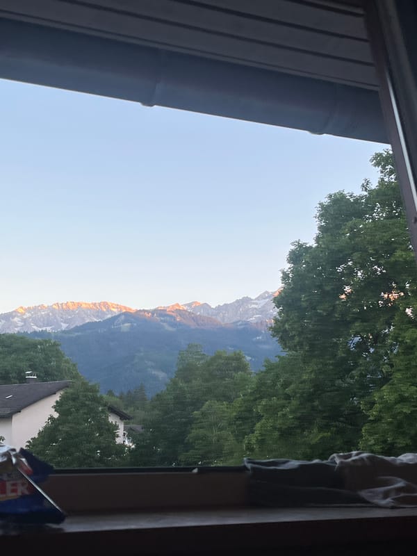 Window view captures scenic Garmisch-Partenkirchen landscape Friday evening