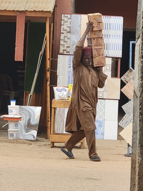 Snack vendors distribute products in Maiburiji, Nigeria