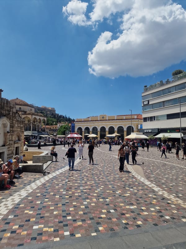 Tourists gather in mosaic square in Athens