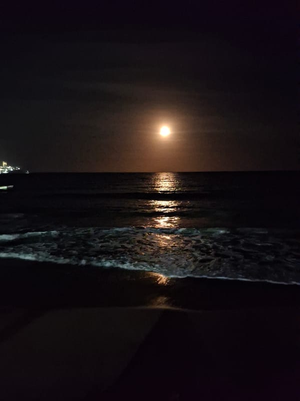 Moonlit beach scenes captured in Pampatar, Venezuela at midnight