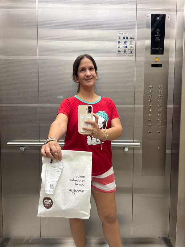 Woman Takes Mirror Selfie in Modern Elevator in Lima