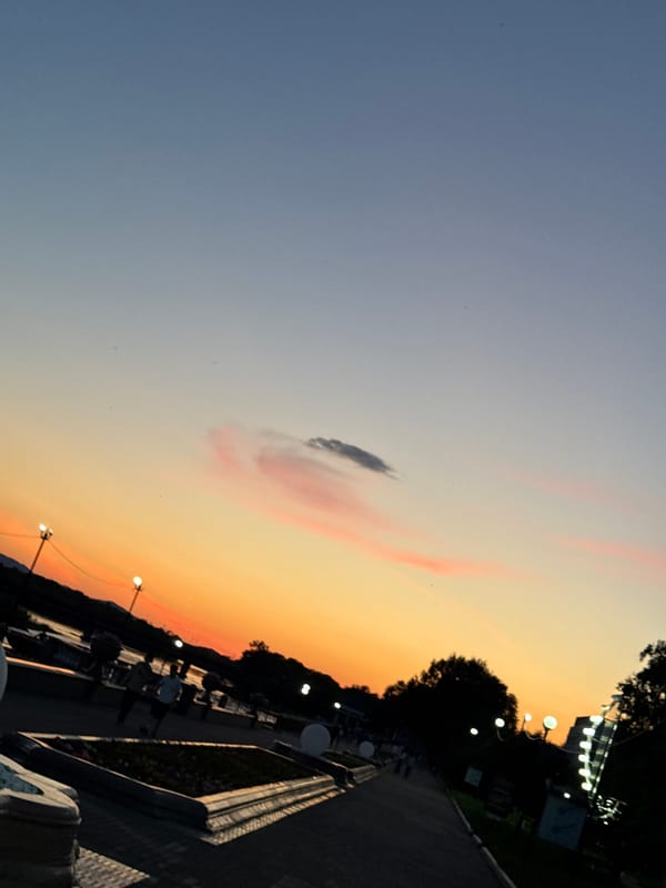 Sunset along Birobidzhan's riverside promenade, late June evening